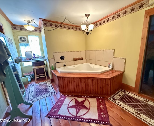 252 Main St, Hudson Falls, NY 12839 - full bathroom featuring hardwood / wood-style flooring, a bath, a chandelier, and ornamental molding