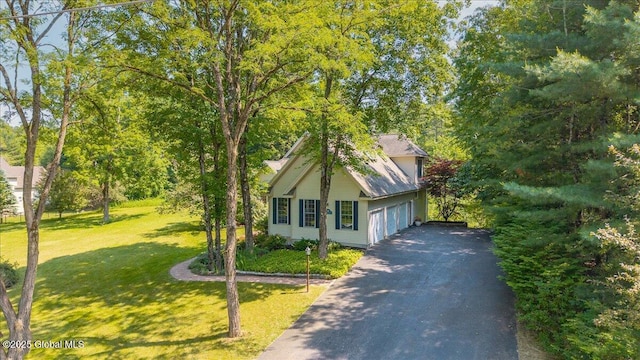 460 Grand Ave, Saratoga Springs, NY 12866 - view of front facade featuring asphalt driveway, a front yard, and a garage