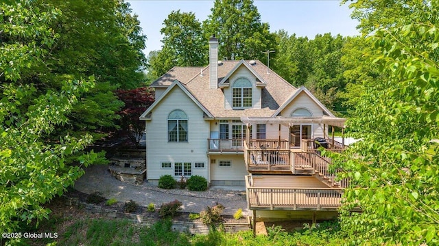 460 Grand Ave, Saratoga Springs, NY 12866 - back of house featuring a deck, a chimney, and a shingled roof