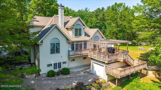 460 Grand Ave, Saratoga Springs, NY 12866 - back of house featuring a deck, a pergola, a shingled roof, a garage, and a chimney