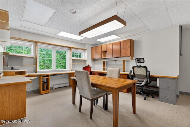 460 Grand Ave, Saratoga Springs, NY 12866 - dining room with a baseboard radiator, light floors, a paneled ceiling, and built in desk