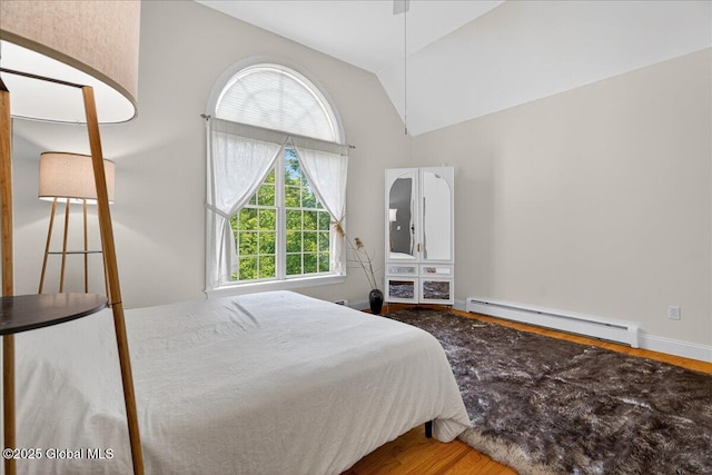 460 Grand Ave, Saratoga Springs, NY 12866 - bedroom featuring baseboard heating, lofted ceiling, and wood finished floors