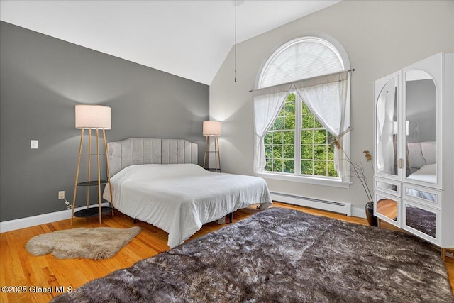 460 Grand Ave, Saratoga Springs, NY 12866 - bedroom featuring a baseboard radiator, lofted ceiling, and wood finished floors