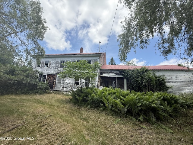 59 Lagrange Rd, Crown Point, NY 12928 - rear view of property featuring a chimney and a metal roof