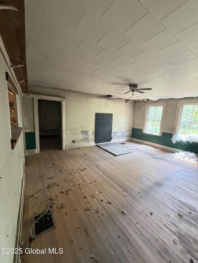 59 Lagrange Rd, Crown Point, NY 12928 - unfurnished living room with hardwood / wood-style floors and ceiling fan