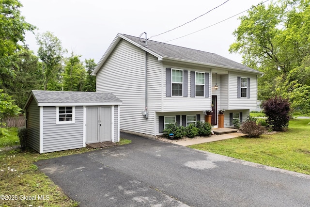 30 W State St, Glens Falls, NY 12801 - raised ranch with a shed, a front yard, and roof with shingles