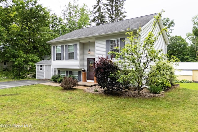 30 W State St, Glens Falls, NY 12801 - raised ranch featuring a front lawn and driveway