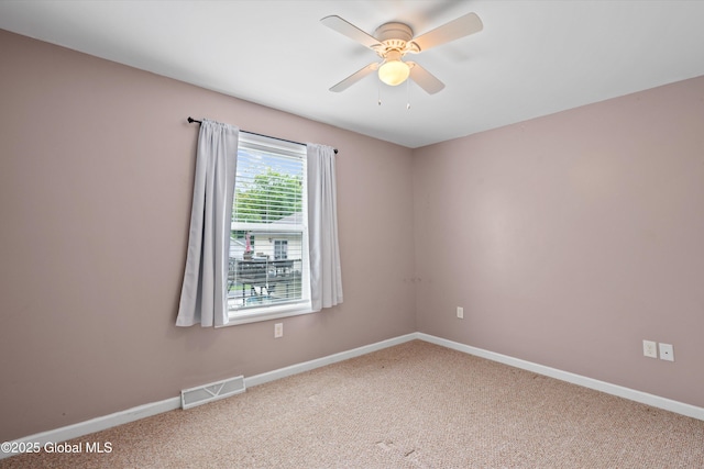 30 W State St, Glens Falls, NY 12801 - carpeted empty room with ceiling fan and baseboards