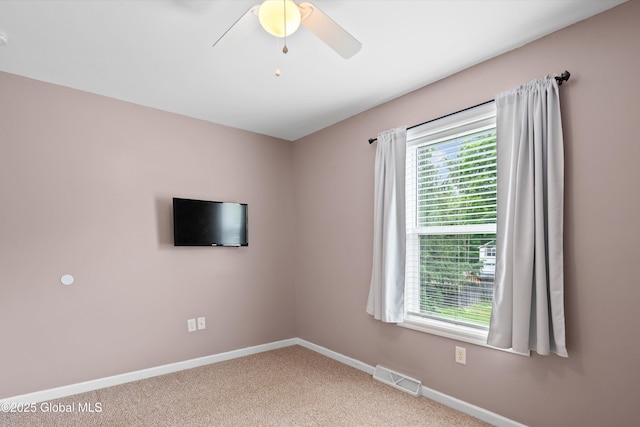 30 W State St, Glens Falls, NY 12801 - unfurnished room with plenty of natural light, carpet, and a ceiling fan