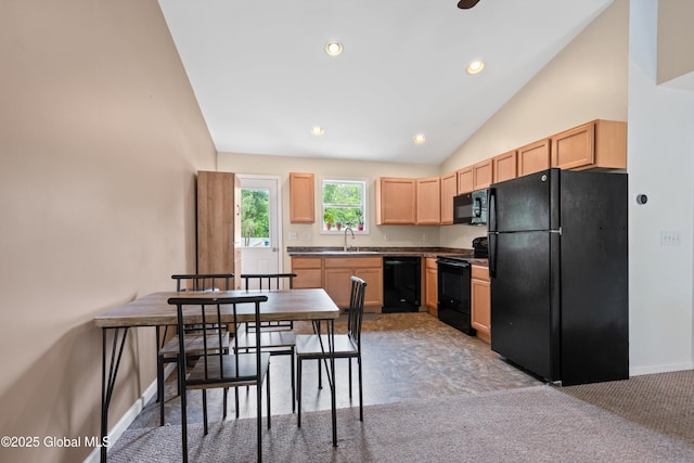 30 W State St, Glens Falls, NY 12801 - kitchen with black appliances, light brown cabinetry, lofted ceiling, dark countertops, and recessed lighting