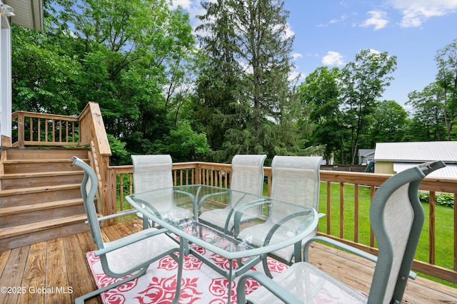 30 W State St, Glens Falls, NY 12801 - wooden deck with outdoor dining space, a yard, and view of wooded area