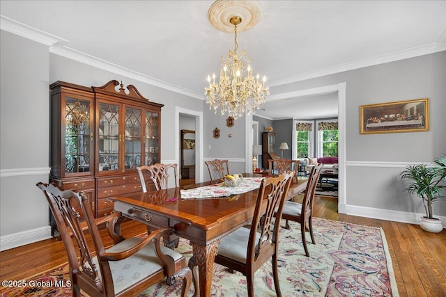 479 Loudon Rd, Colonie, NY 12211 - dining area featuring hardwood / wood-style floors, a chandelier, and crown molding