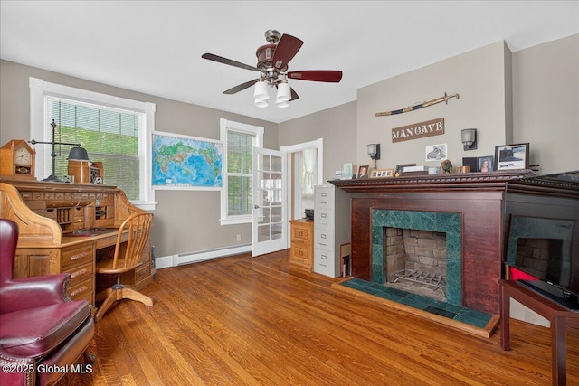 479 Loudon Rd, Colonie, NY 12211 - office space with a baseboard radiator, a premium fireplace, wood finished floors, and ceiling fan