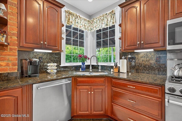 479 Loudon Rd, Colonie, NY 12211 - kitchen with stainless steel appliances, tasteful backsplash, dark stone countertops, and brown cabinetry