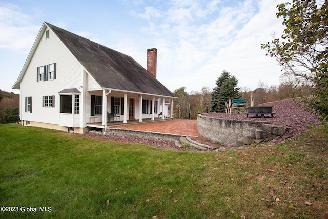 42 Stanton Rd, Jackson, NY 12873 - back of house featuring a chimney, a porch, and a yard