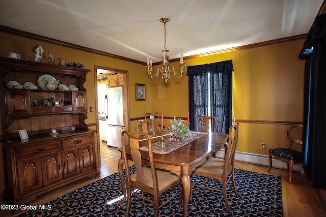 42 Stanton Rd, Jackson, NY 12873 - dining room with a chandelier, light wood-style floors, crown molding, and a baseboard heating unit