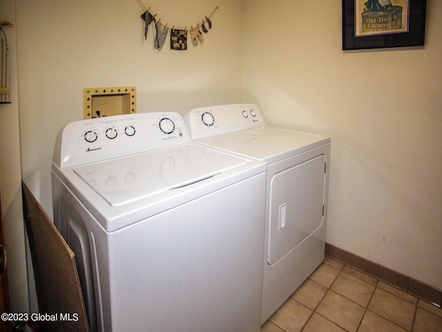 42 Stanton Rd, Jackson, NY 12873 - laundry room featuring washer and clothes dryer and light tile patterned floors