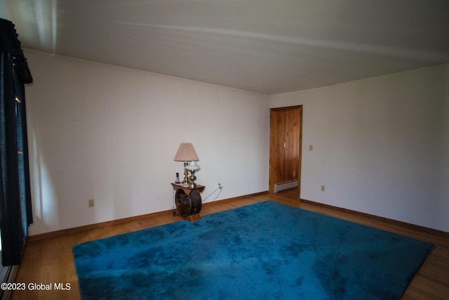 42 Stanton Rd, Jackson, NY 12873 - empty room with a baseboard radiator and wood finished floors