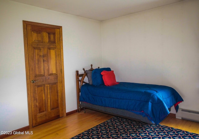 42 Stanton Rd, Jackson, NY 12873 - bedroom with wood finished floors and a baseboard radiator