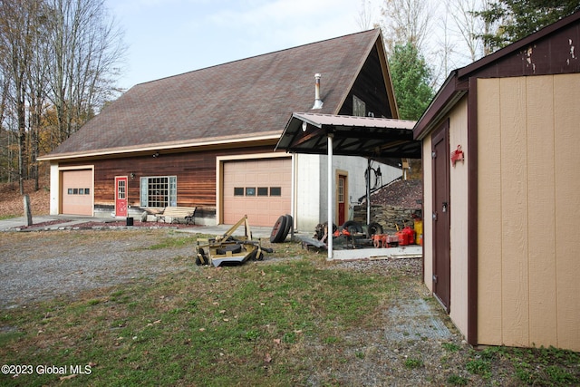 42 Stanton Rd, Jackson, NY 12873 - view of side of home featuring an outdoor structure, a garage, and dirt driveway