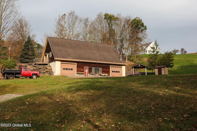 42 Stanton Rd, Jackson, NY 12873 - view of front of house featuring a garage, an outdoor structure, and a front lawn