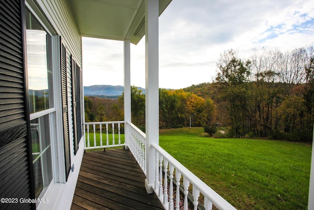 42 Stanton Rd, Jackson, NY 12873 - wooden terrace with a lawn and a wooded view