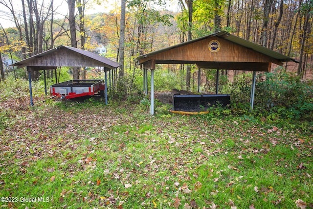 42 Stanton Rd, Jackson, NY 12873 - view of home's community with a carport and a forest view