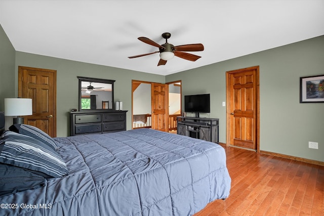 1560 Division St, Charlton, NY 12010 - bedroom with light wood finished floors and a ceiling fan