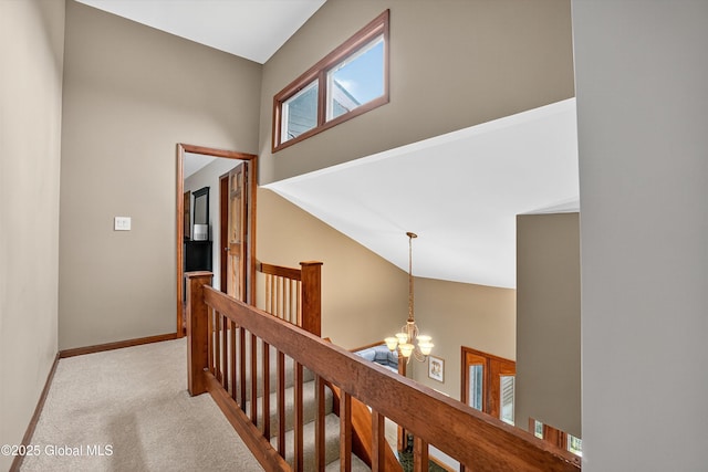1560 Division St, Charlton, NY 12010 - corridor featuring an upstairs landing, a chandelier, carpet, and high vaulted ceiling