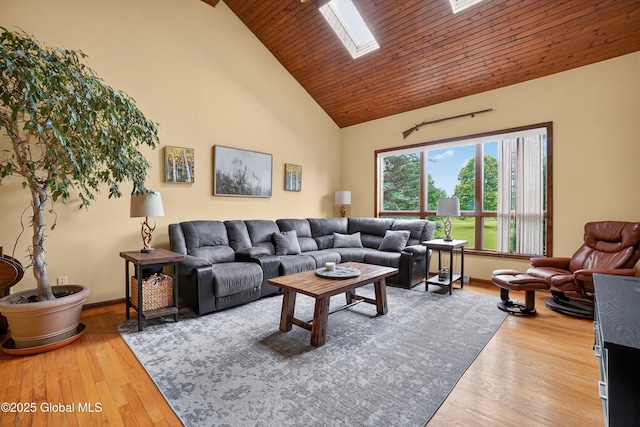 1560 Division St, Charlton, NY 12010 - living room featuring high vaulted ceiling, wood finished floors, wooden ceiling, and a skylight