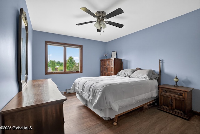 1560 Division St, Charlton, NY 12010 - bedroom featuring baseboard heating, dark wood-style floors, and a ceiling fan