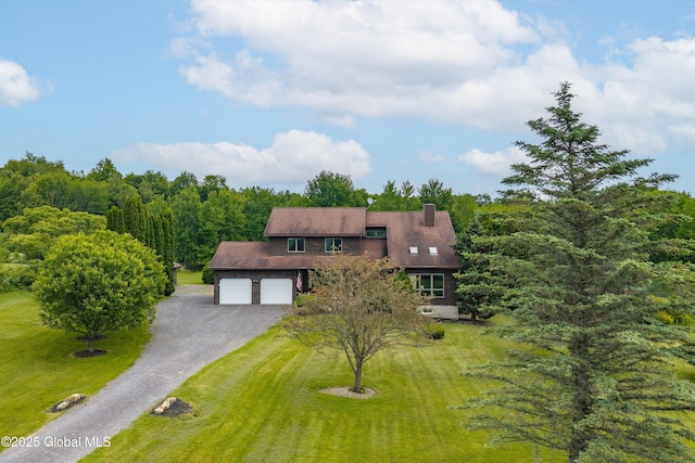 1560 Division St, Charlton, NY 12010 - view of front of home featuring driveway, a front yard, and a chimney