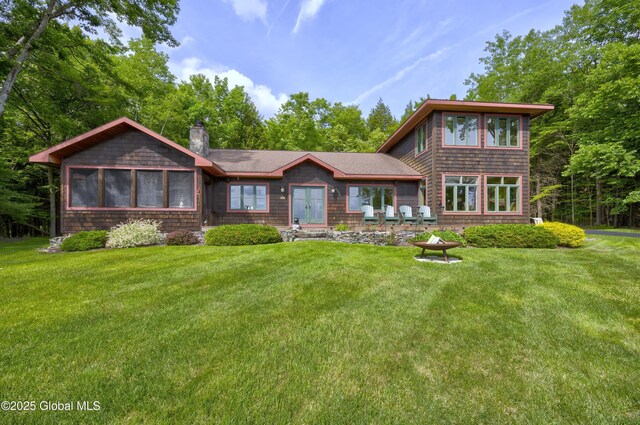 555 Trout Lake Rd, Bolton, NY 12824 - view of front facade featuring a chimney and a front lawn