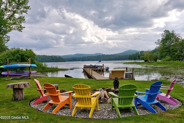 555 Trout Lake Rd, Bolton, NY 12824 - exterior space featuring a boat dock, an outdoor fire pit, and mountains