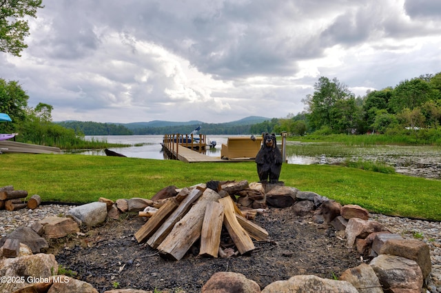 555 Trout Lake Rd, Bolton, NY 12824 - view of grassy yard with a water and mountain view and a dock