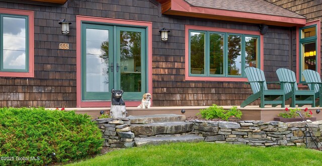 555 Trout Lake Rd, Bolton, NY 12824 - doorway to property featuring a shingled roof