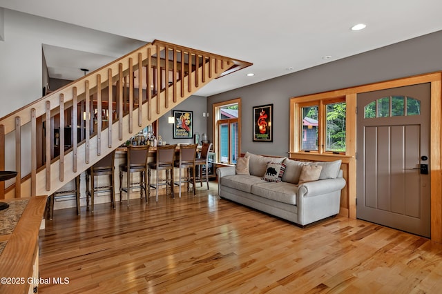 555 Trout Lake Rd, Bolton, NY 12824 - living room featuring wood finished floors, recessed lighting, bar area, and stairway