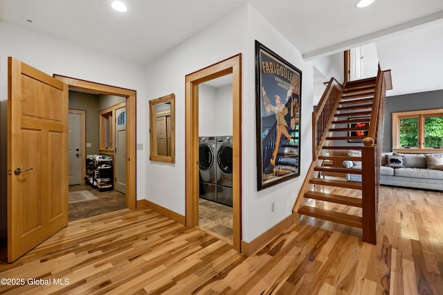 555 Trout Lake Rd, Bolton, NY 12824 - corridor with washing machine and clothes dryer, stairway, light wood finished floors, and recessed lighting