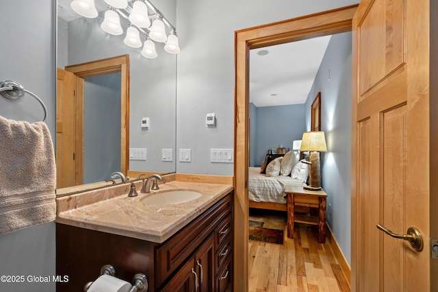 555 Trout Lake Rd, Bolton, NY 12824 - ensuite bathroom featuring vanity and wood finished floors