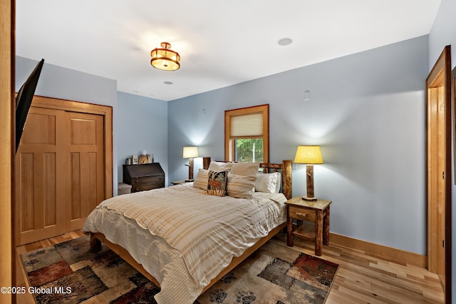 555 Trout Lake Rd, Bolton, NY 12824 - bedroom featuring light wood-style flooring and baseboards