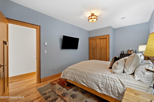 555 Trout Lake Rd, Bolton, NY 12824 - bedroom featuring light wood finished floors and a closet