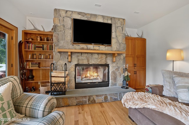 555 Trout Lake Rd, Bolton, NY 12824 - living area featuring wood finished floors and a fireplace
