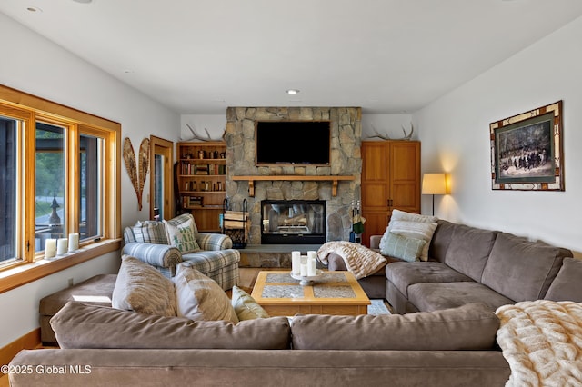 555 Trout Lake Rd, Bolton, NY 12824 - living room featuring a stone fireplace and wood finished floors