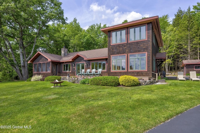 555 Trout Lake Rd, Bolton, NY 12824 - chalet / cabin featuring a front yard, a chimney, and roof with shingles