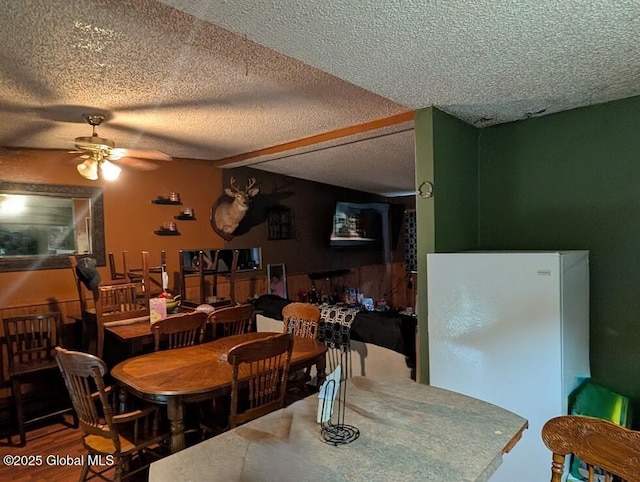 312 Ridge Rd, Northampton, NY 12134 - dining area with ceiling fan, a textured ceiling, and wood finished floors