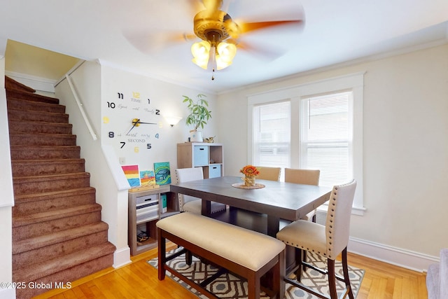 66 Roosevelt Ave, Schenectady, NY 12304 - dining room featuring stairs, ceiling fan, light wood-type flooring, and crown molding