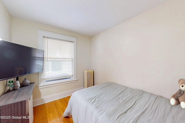 66 Roosevelt Ave, Schenectady, NY 12304 - bedroom featuring radiator and light wood finished floors