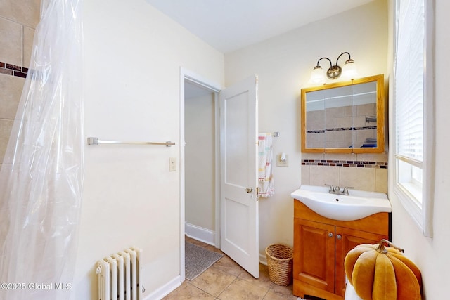 66 Roosevelt Ave, Schenectady, NY 12304 - full bath with radiator, vanity, tile patterned floors, and backsplash