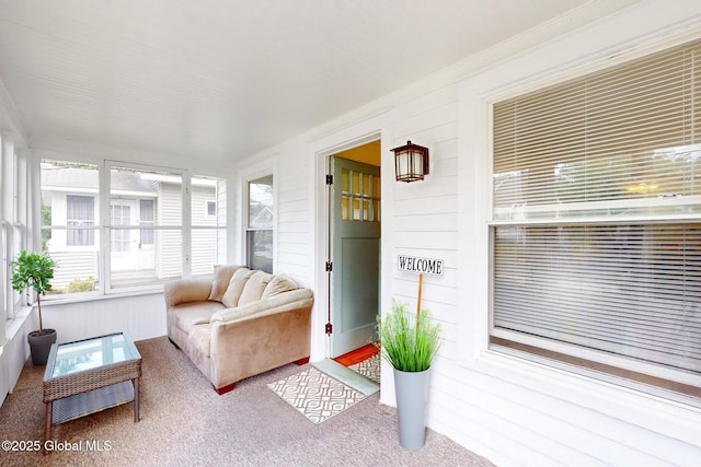 66 Roosevelt Ave, Schenectady, NY 12304 - sunroom / solarium featuring carpet flooring, ornamental molding, and wood walls