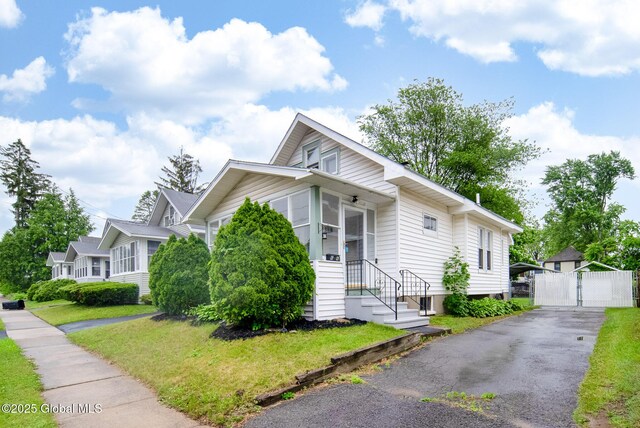 66 Roosevelt Ave, Schenectady, NY 12304 - bungalow-style house featuring a gate and asphalt driveway